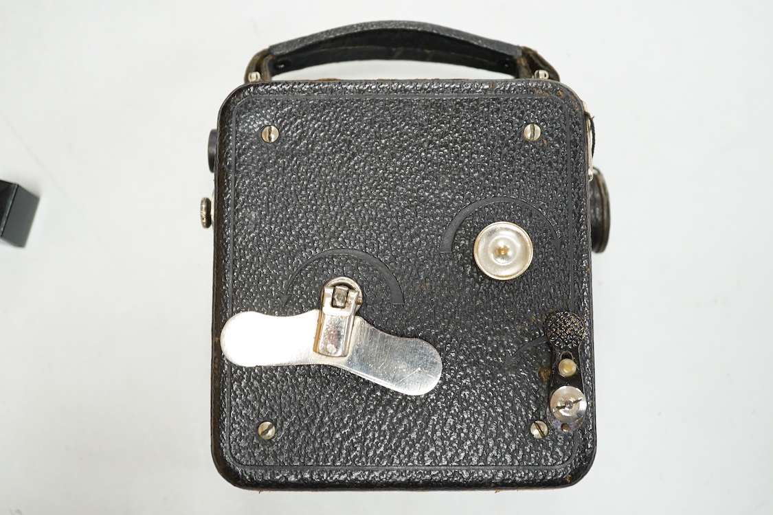 A Pathescope Moto camera 9.5mm cine camera in a brown leather case